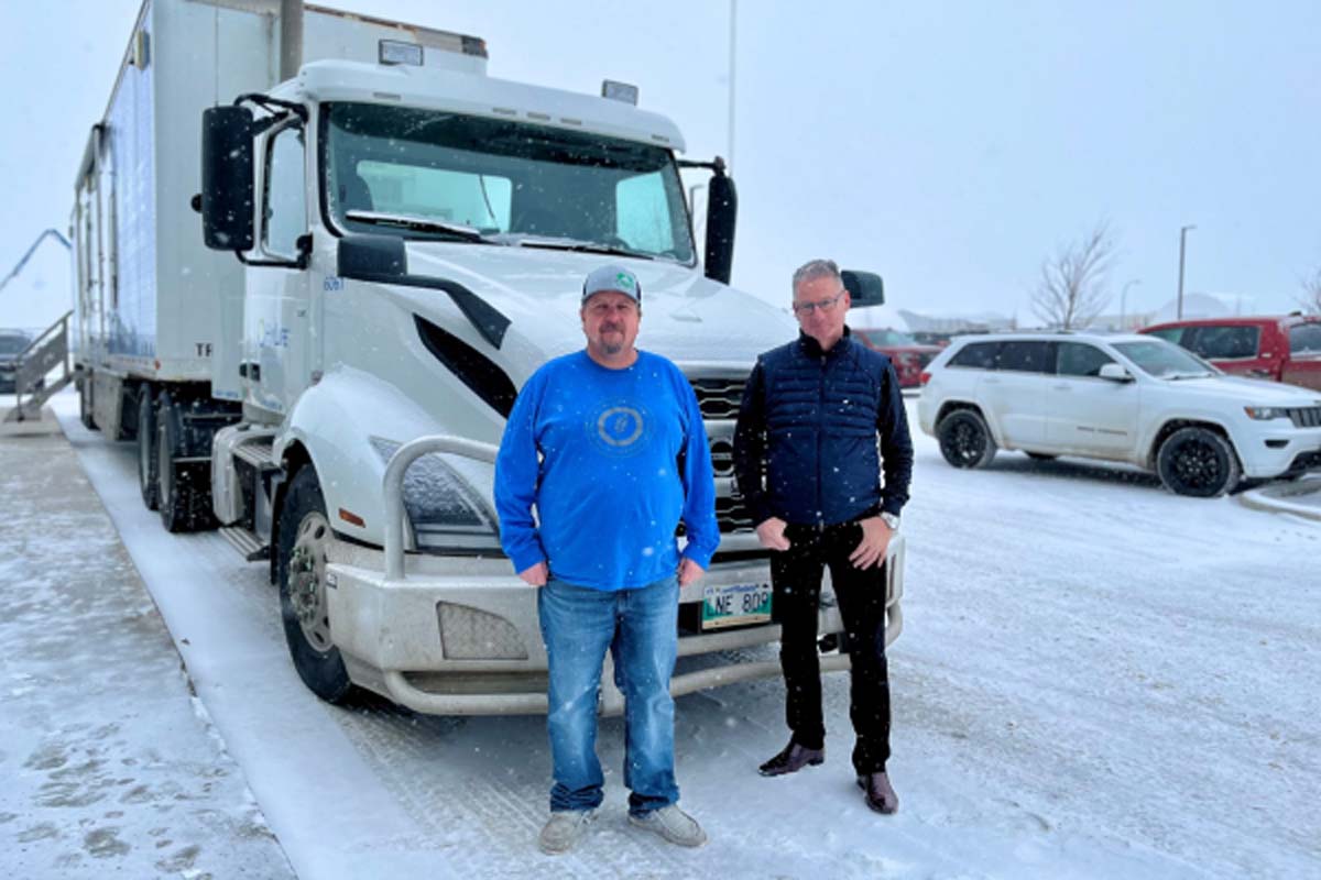 Transportation team gathered near the HyLife Driver Simulator Mobile Classroom showcasing safety training initiatives