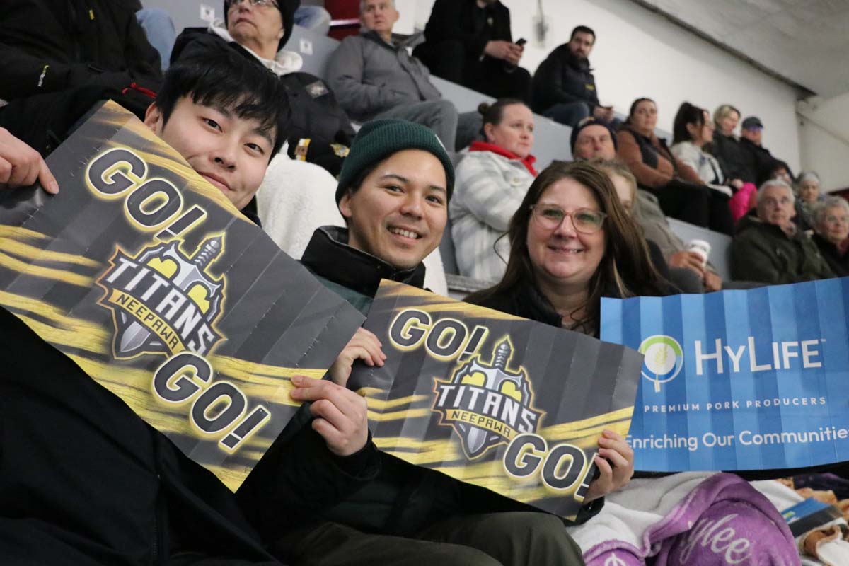 Event attendees enjoying a community hockey game supported by HyLife