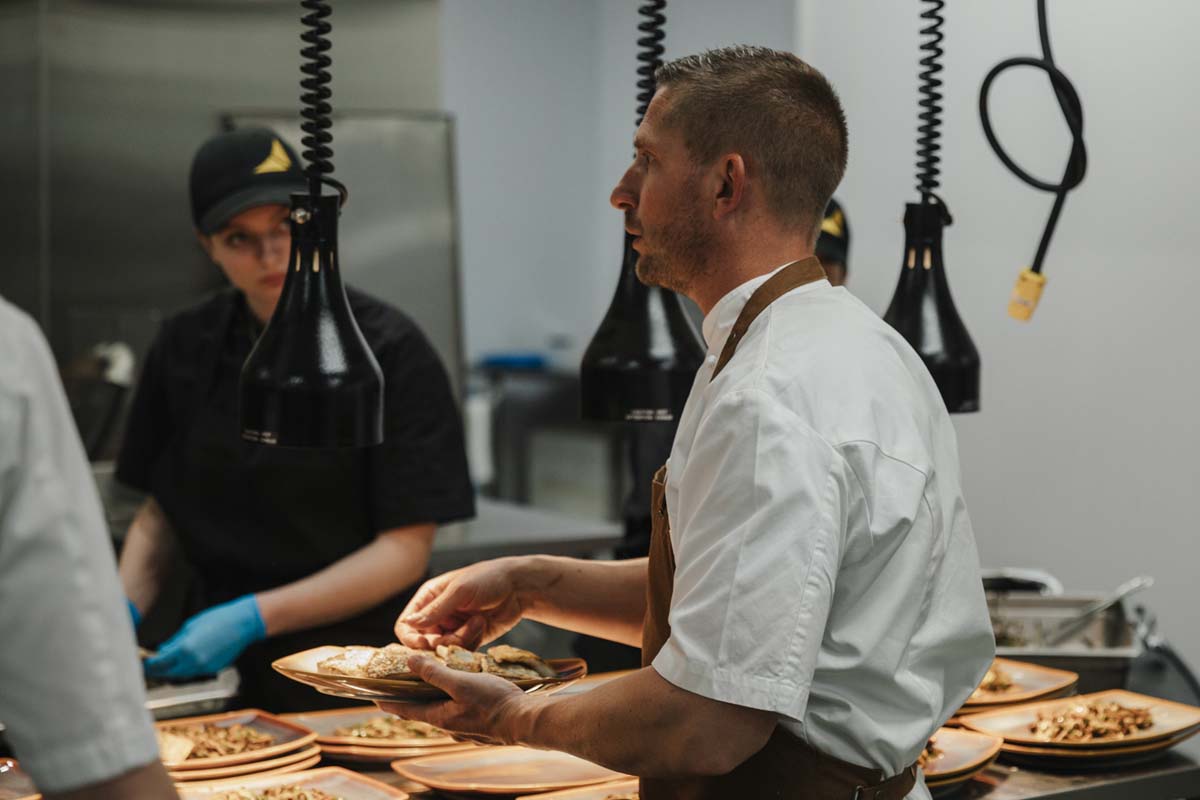 Food preparation and service at a community event supported by HyLife