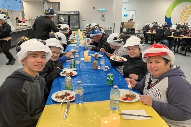 HyLife employees celebrating workplace achievements together