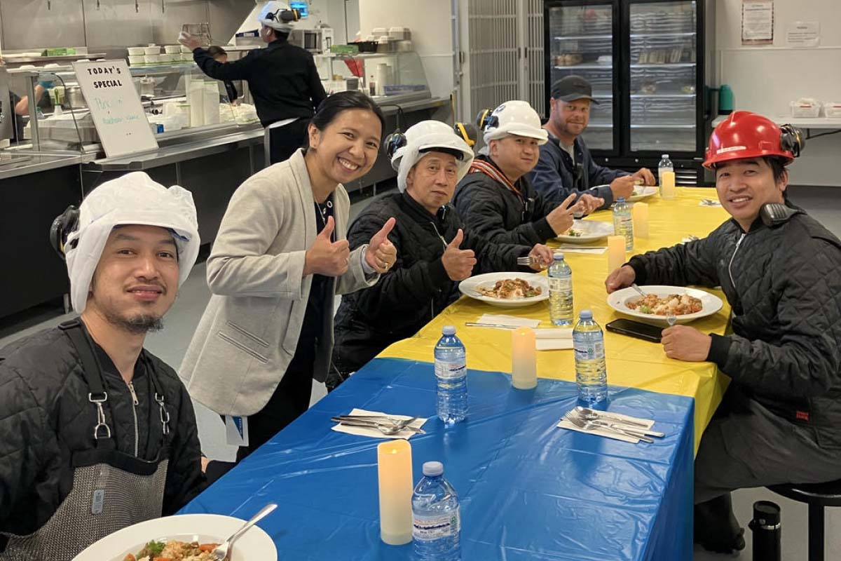 Team members enjoying a shared meal during an employee recognition event