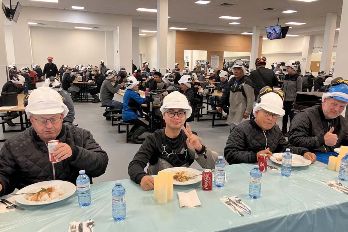 Employees coming together to celebrate achievements at HyLife