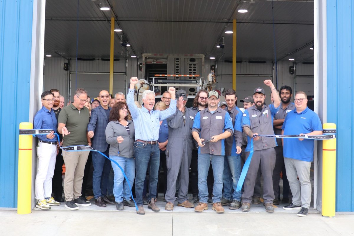 HyLife fleet team gathered at a new transportation facility milestone
